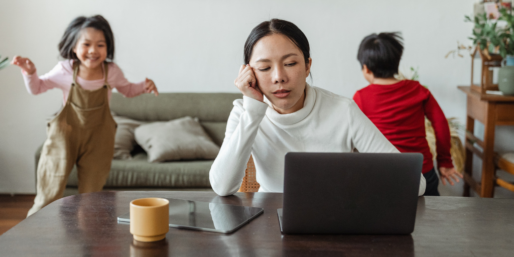 work from home mum with kids running around