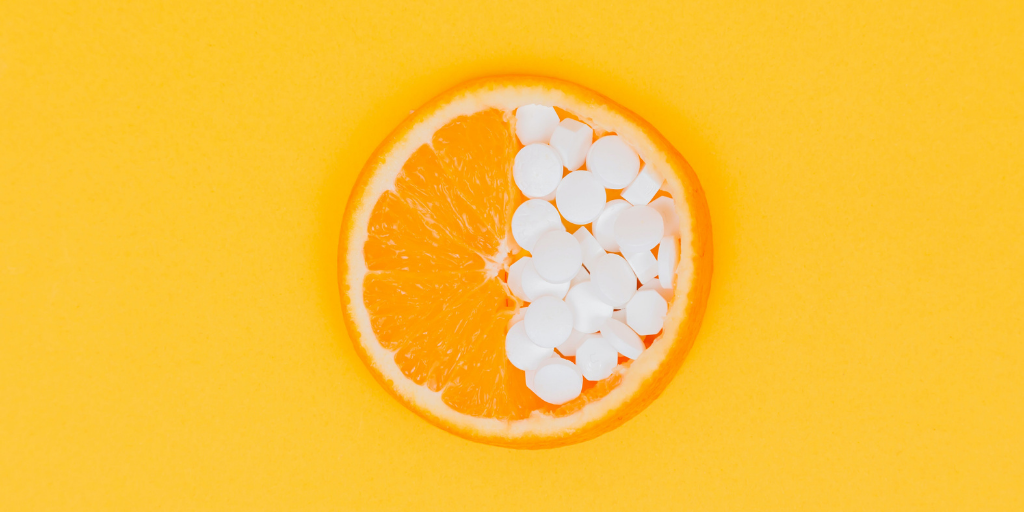 slice of orange with pills